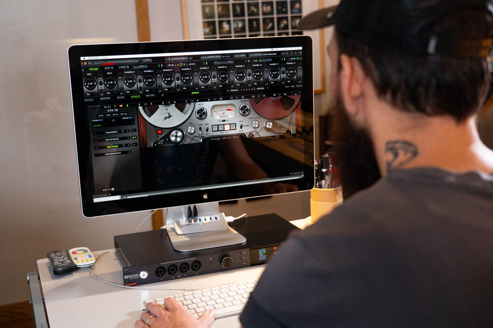 Drew Bang looking at the control panel of Orion Studio Synergy Core