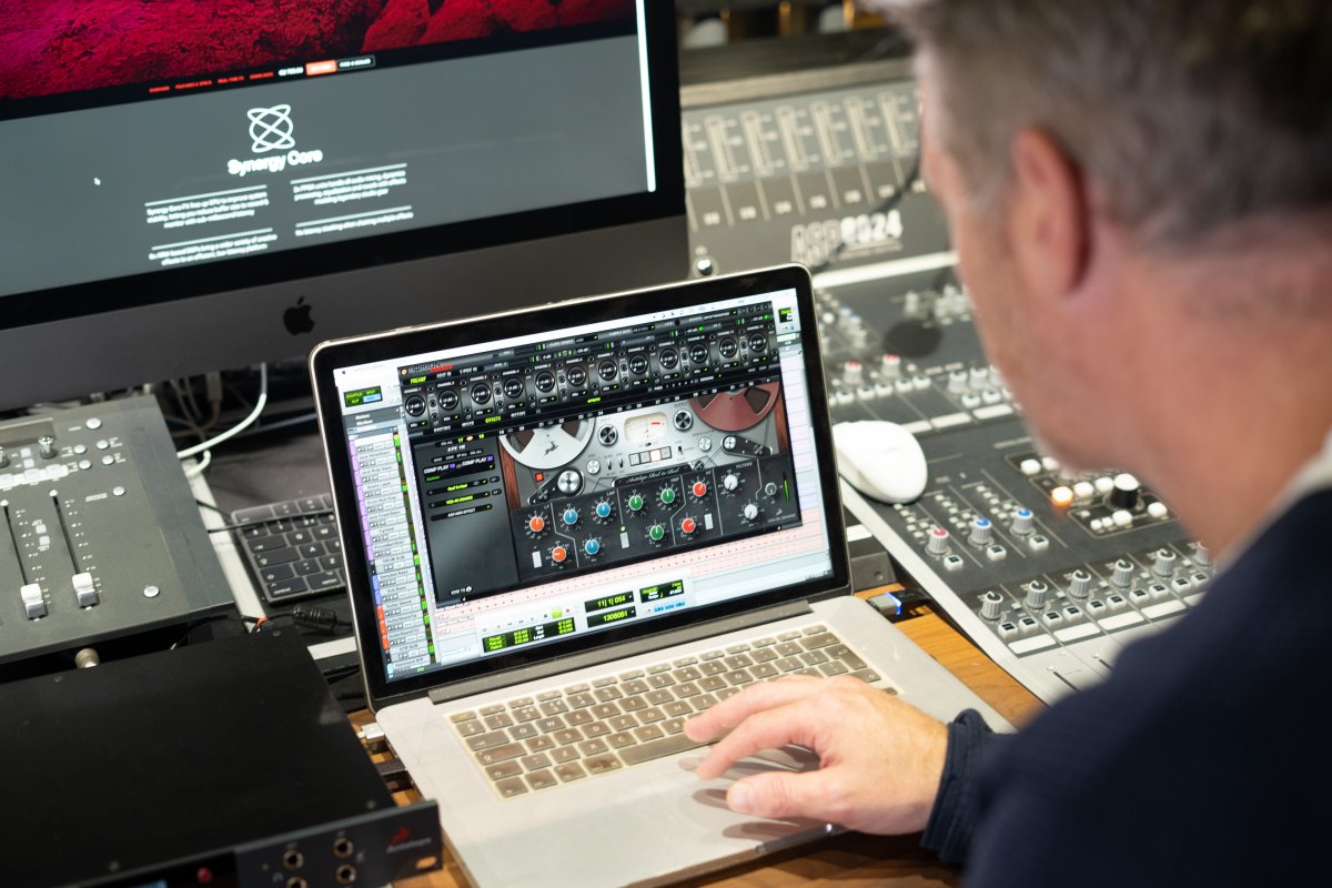 Producer Jason O'Bryan working on his laptop